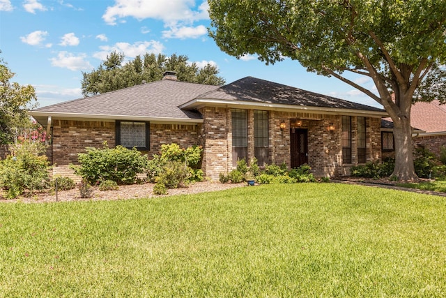 10009 Apple Creek Dr, Dallas, TX 75243 - single story home with a front lawn, brick siding, a chimney, and a shingled roof