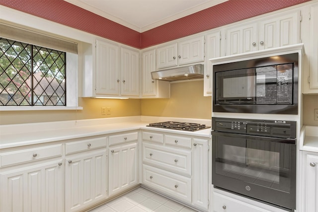 10009 Apple Creek Dr, Dallas, TX 75243 - kitchen featuring black appliances, under cabinet range hood, light countertops, white cabinetry, and ornamental molding