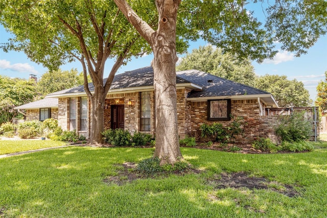 10009 Apple Creek Dr, Dallas, TX 75243 - ranch-style house with a front lawn, brick siding, and roof with shingles