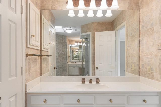 10009 Apple Creek Dr, Dallas, TX 75243 - bathroom featuring vanity and a shower with shower door