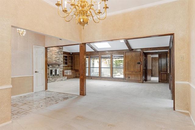10009 Apple Creek Dr, Dallas, TX 75243 - unfurnished living room featuring a chandelier, carpet, built in features, a fireplace, and a towering ceiling