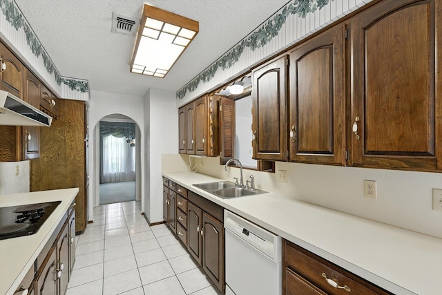 233 Hillview Dr, Hurst, TX 76054 - kitchen with dishwasher, arched walkways, black electric stovetop, light countertops, and light tile patterned floors