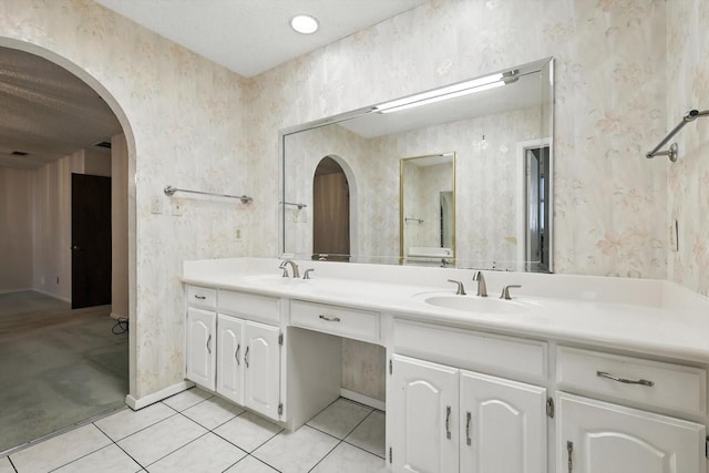 233 Hillview Dr, Hurst, TX 76054 - full bathroom featuring double vanity, wallpapered walls, and tile patterned floors