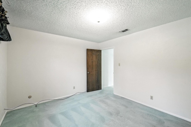 233 Hillview Dr, Hurst, TX 76054 - carpeted empty room with a textured ceiling