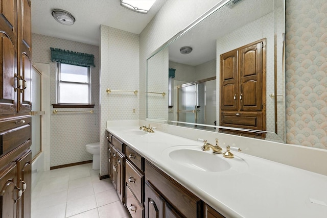 233 Hillview Dr, Hurst, TX 76054 - bathroom featuring wallpapered walls, double vanity, and tile patterned flooring