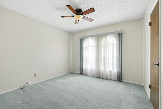 233 Hillview Dr, Hurst, TX 76054 - spare room featuring light carpet, a ceiling fan, and a textured ceiling