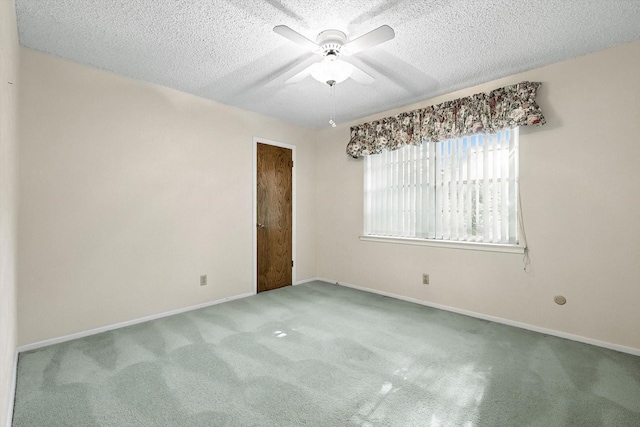 233 Hillview Dr, Hurst, TX 76054 - spare room with a ceiling fan, carpet flooring, and a textured ceiling