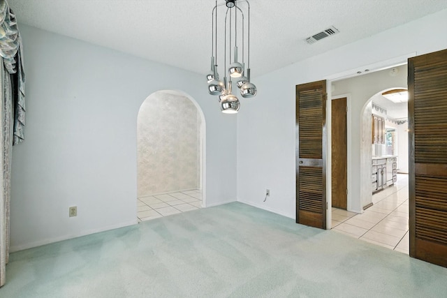 233 Hillview Dr, Hurst, TX 76054 - carpeted empty room featuring arched walkways and tile patterned floors