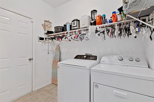 10027 Hanover Dr, Providence Village, TX 76227 - laundry room featuring washer and clothes dryer and light tile patterned floors