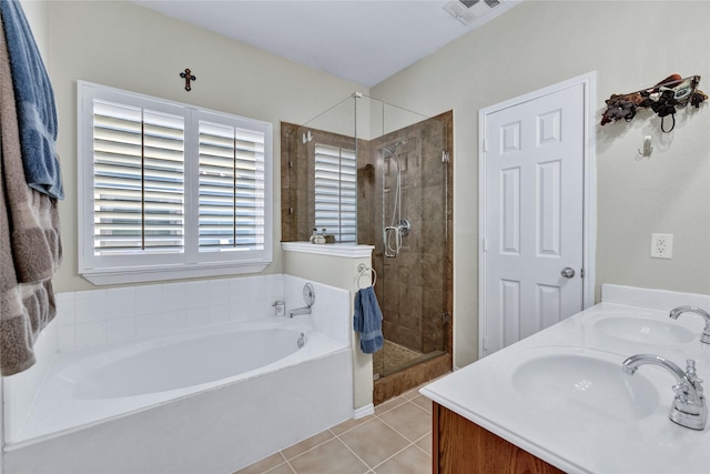 10027 Hanover Dr, Providence Village, TX 76227 - full bath featuring a garden tub, tile patterned floors, a stall shower, and double vanity