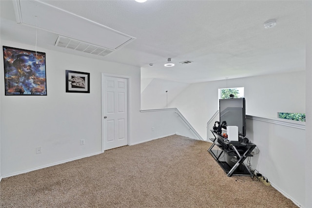 10027 Hanover Dr, Providence Village, TX 76227 - unfurnished room featuring attic access, carpet flooring, and an upstairs landing