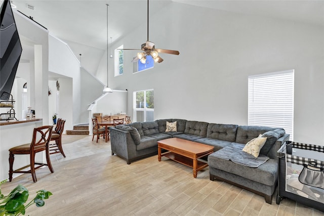 10027 Hanover Dr, Providence Village, TX 76227 - living room with ceiling fan, high vaulted ceiling, and light wood finished floors