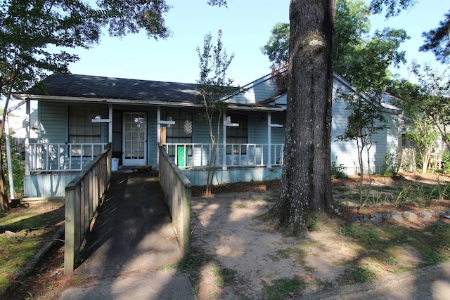 1 Mason St, Minden, LA 71055 - view of front facade with covered porch and roof with shingles