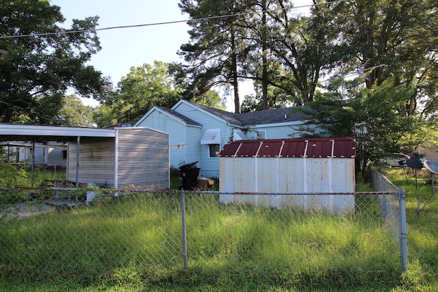 1 Mason St, Minden, LA 71055 - view of side of home with a shed