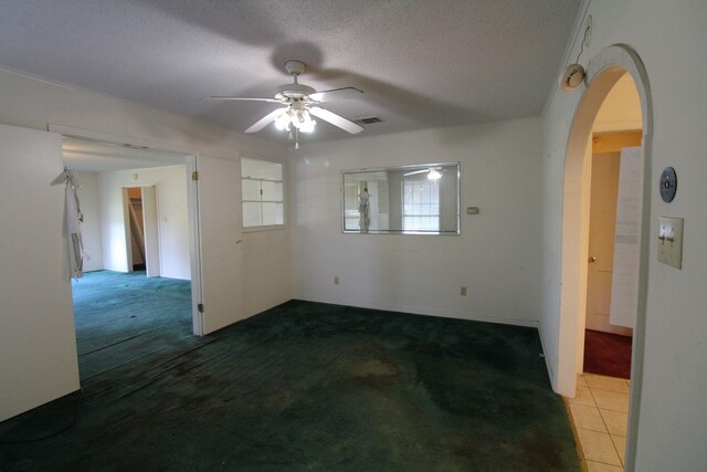 1 Mason St, Minden, LA 71055 - carpeted spare room featuring a ceiling fan, arched walkways, and a textured ceiling