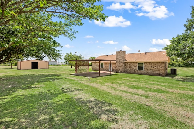 7655 Veal Station Rd, Azle, TX 76020 - view of green lawn featuring an outbuilding, an outdoor structure, and a patio area