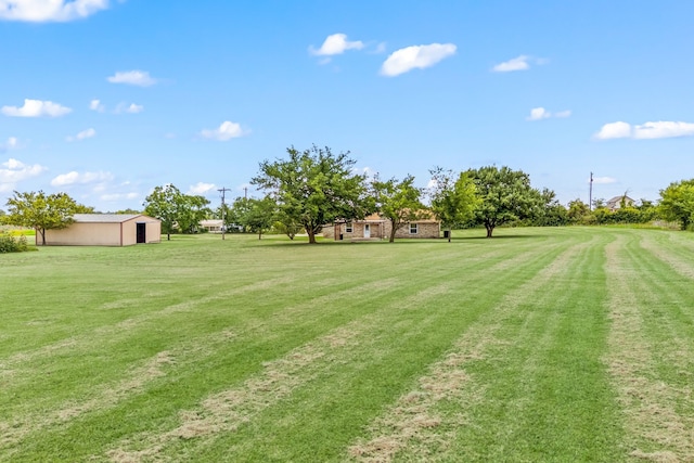 7655 Veal Station Rd, Azle, TX 76020 - view of green lawn with an outbuilding