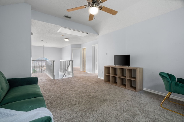 8347 Mountainview Dr, Dallas, TX 75249 - living area featuring carpet floors, ceiling fan, a textured ceiling, and attic access