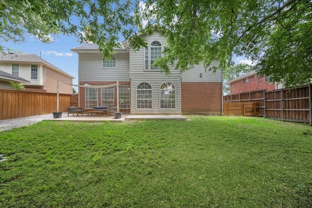 8347 Mountainview Dr, Dallas, TX 75249 - rear view of house featuring brick siding, a patio area, and a fenced backyard