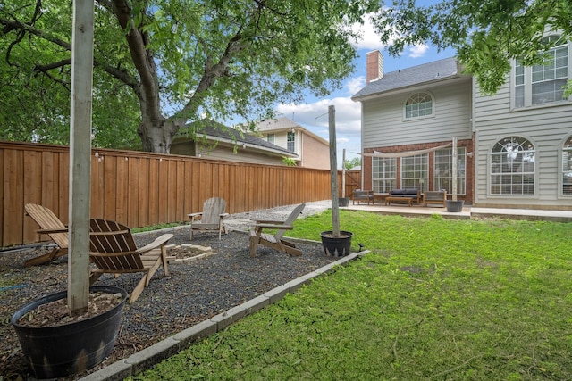 8347 Mountainview Dr, Dallas, TX 75249 - fenced backyard with a patio area and an outdoor living space with a fire pit