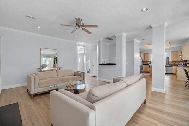 8347 Mountainview Dr, Dallas, TX 75249 - living room featuring ceiling fan, crown molding, a textured ceiling, light wood-type flooring, and recessed lighting