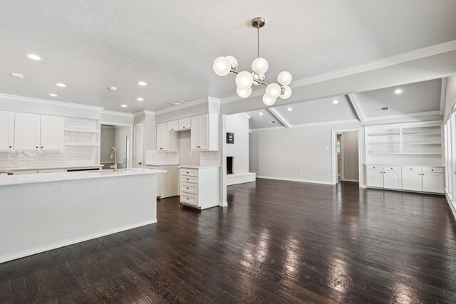6714 Barkworth Dr, Dallas, TX 75248 - unfurnished living room with dark wood finished floors, a chandelier, recessed lighting, ornamental molding, and beamed ceiling