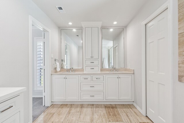 6714 Barkworth Dr, Dallas, TX 75248 - bathroom featuring double vanity and recessed lighting