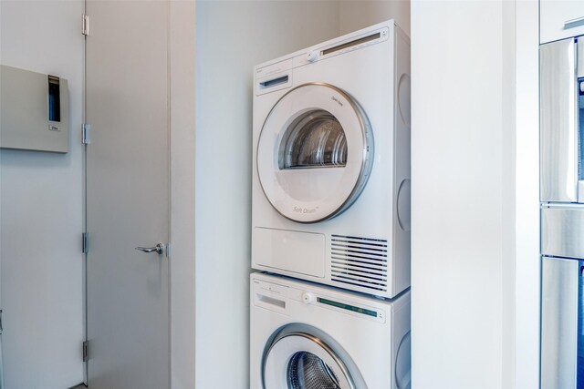 1717 Arts Plz Unit 1808, Dallas, TX 75201 - laundry room with stacked washing machine and dryer
