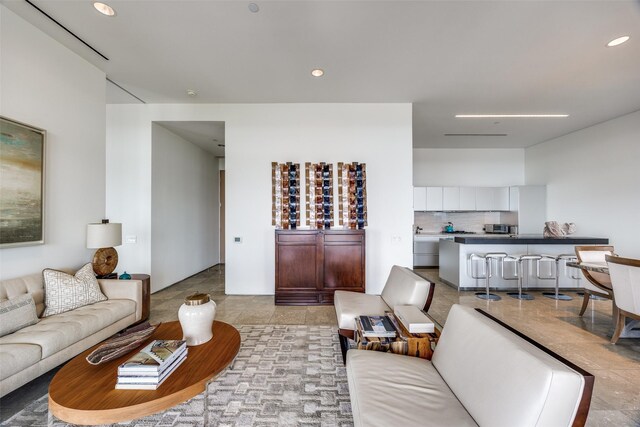 1717 Arts Plz Unit 1808, Dallas, TX 75201 - living area with recessed lighting and light tile patterned floors
