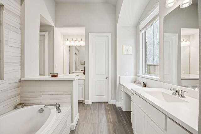 12229 Prudence Dr, Fort Worth, TX 76052 - bathroom with two vanities and a bath