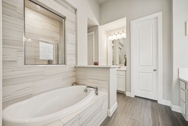 12229 Prudence Dr, Fort Worth, TX 76052 - bathroom with vanity and a garden tub