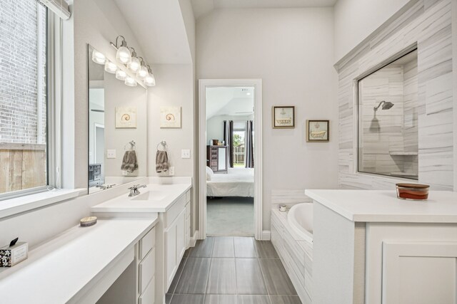 12229 Prudence Dr, Fort Worth, TX 76052 - bathroom with a garden tub, vanity, ensuite bathroom, a tile shower, and lofted ceiling