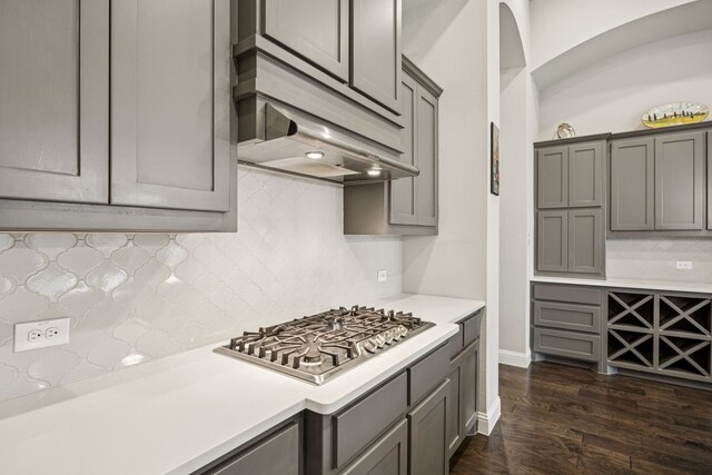 12229 Prudence Dr, Fort Worth, TX 76052 - kitchen with stainless steel gas stovetop, gray cabinetry, light countertops, and custom exhaust hood