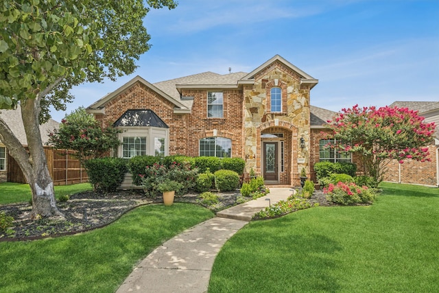1613 Country Brook Ln, Allen, TX 75002 - view of front of home featuring brick siding, a shingled roof, and stone siding