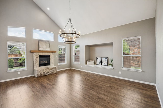 1613 Country Brook Ln, Allen, TX 75002 - unfurnished living room featuring a chandelier, high vaulted ceiling, hardwood / wood-style flooring, and a fireplace