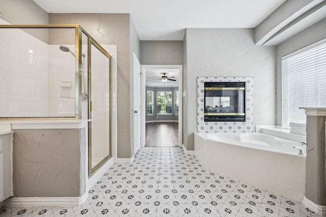 1613 Country Brook Ln, Allen, TX 75002 - full bathroom with a bath, a shower stall, a ceiling fan, and a premium fireplace