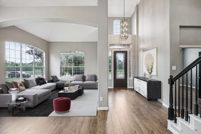 1613 Country Brook Ln, Allen, TX 75002 - entryway featuring hardwood / wood-style flooring, healthy amount of natural light, stairway, a chandelier, and a high ceiling