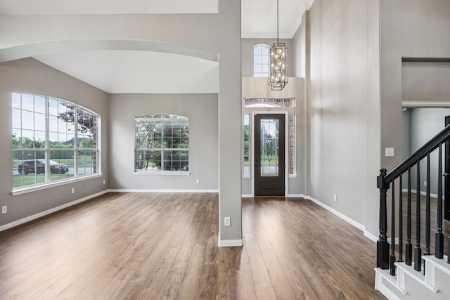 1613 Country Brook Ln, Allen, TX 75002 - foyer entrance featuring healthy amount of natural light, wood finished floors, stairway, and a chandelier