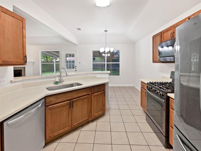 122 Driftwood Ln, Waxahachie, TX 75165 - kitchen featuring stainless steel appliances, brown cabinets, and light countertops