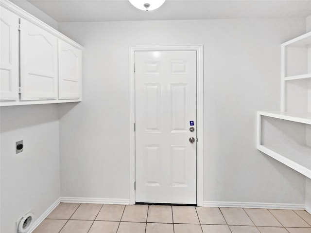 122 Driftwood Ln, Waxahachie, TX 75165 - laundry area featuring hookup for an electric dryer, cabinet space, and light tile patterned flooring