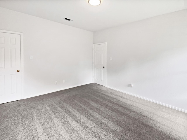 122 Driftwood Ln, Waxahachie, TX 75165 - unfurnished room with dark colored carpet and baseboards