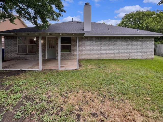 122 Driftwood Ln, Waxahachie, TX 75165 - rear view of house with a patio area, brick siding, a chimney, and a shingled roof