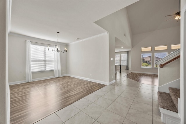 3204 Wimberley Ln, Rockwall, TX 75032 - unfurnished room featuring a chandelier, ornamental molding, light tile patterned flooring, stairway, and ceiling fan