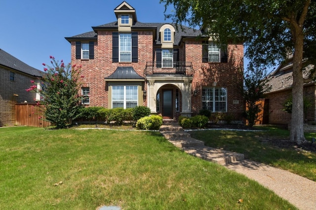 9750 Candlewood Dr, Frisco, TX 75033 - view of front of house with a balcony and brick siding
