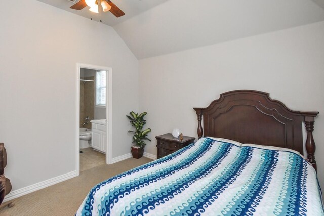 9750 Candlewood Dr, Frisco, TX 75033 - bedroom featuring light colored carpet, lofted ceiling, ensuite bath, and a ceiling fan