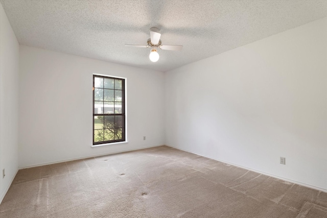 713 E Peel St, Pilot Point, TX 76258 - carpeted empty room featuring a ceiling fan and a textured ceiling