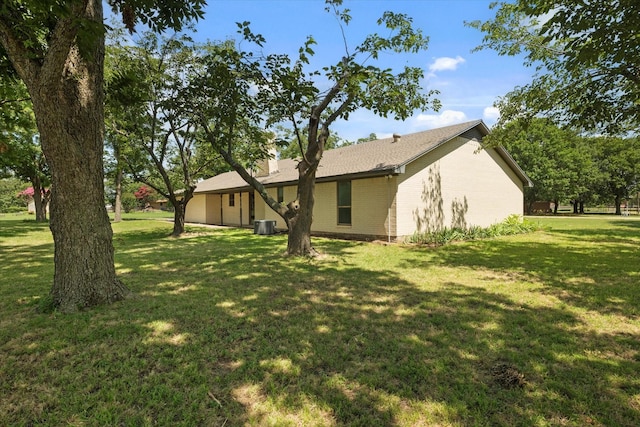 713 E Peel St, Pilot Point, TX 76258 - view of side of property featuring brick siding and a yard
