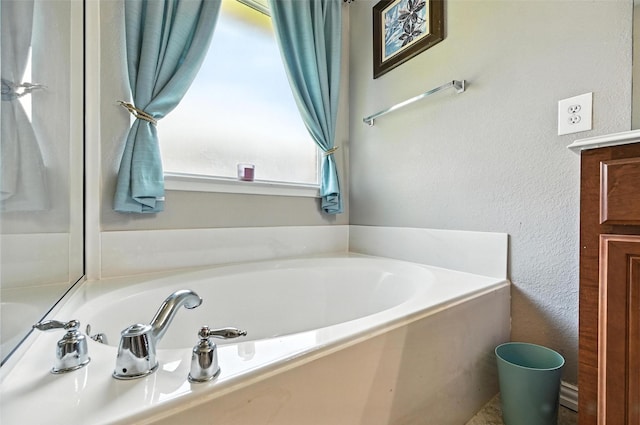 9210 Wild River Dr, Arlington, TX 76002 - full bathroom with a garden tub and a textured wall