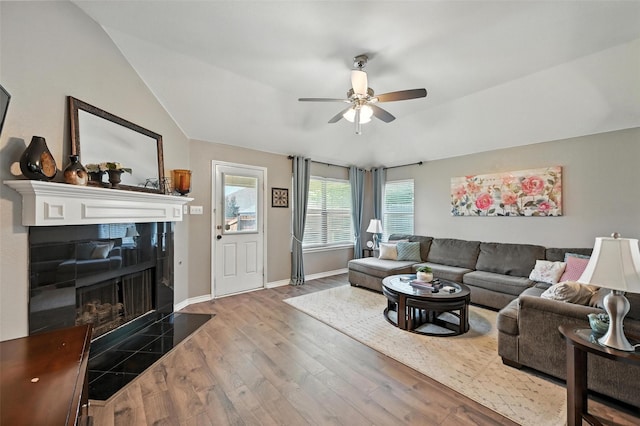 9210 Wild River Dr, Arlington, TX 76002 - living area with ceiling fan, wood finished floors, a tiled fireplace, and vaulted ceiling