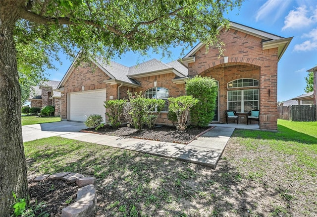 9210 Wild River Dr, Arlington, TX 76002 - traditional-style home featuring brick siding, an attached garage, concrete driveway, and roof with shingles